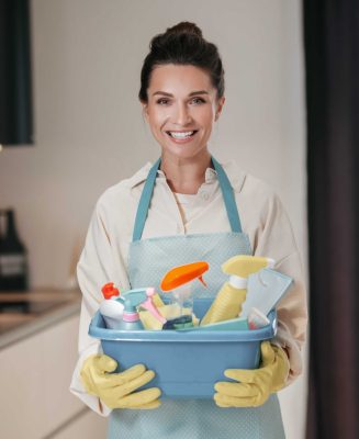 housewife-young-smiling-woman-with-basin-with-cleansing-appliances (1)